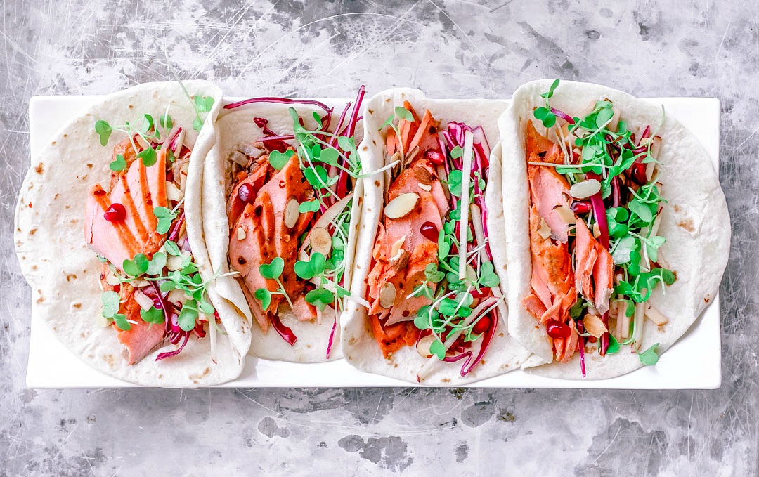 sweet and spicy salmon tacos with apple almond slaw