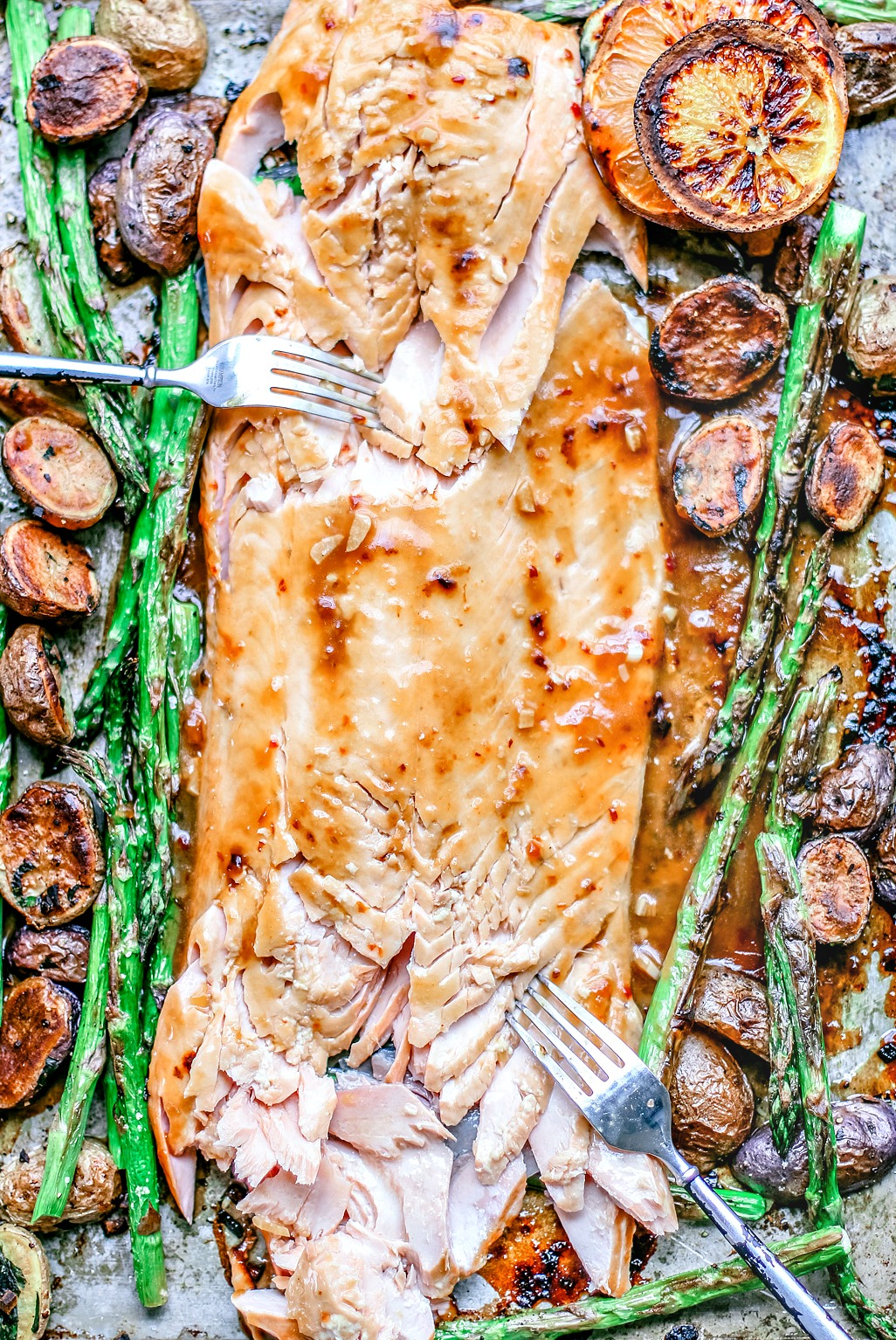 Easy Honey Citrus Sheet Pan Salmon with salmon flaked with a fork