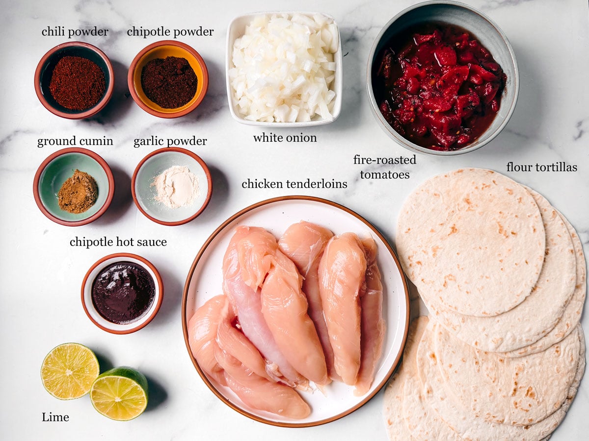 Ingredients for chipotle shredded chicken tacos on a white background.