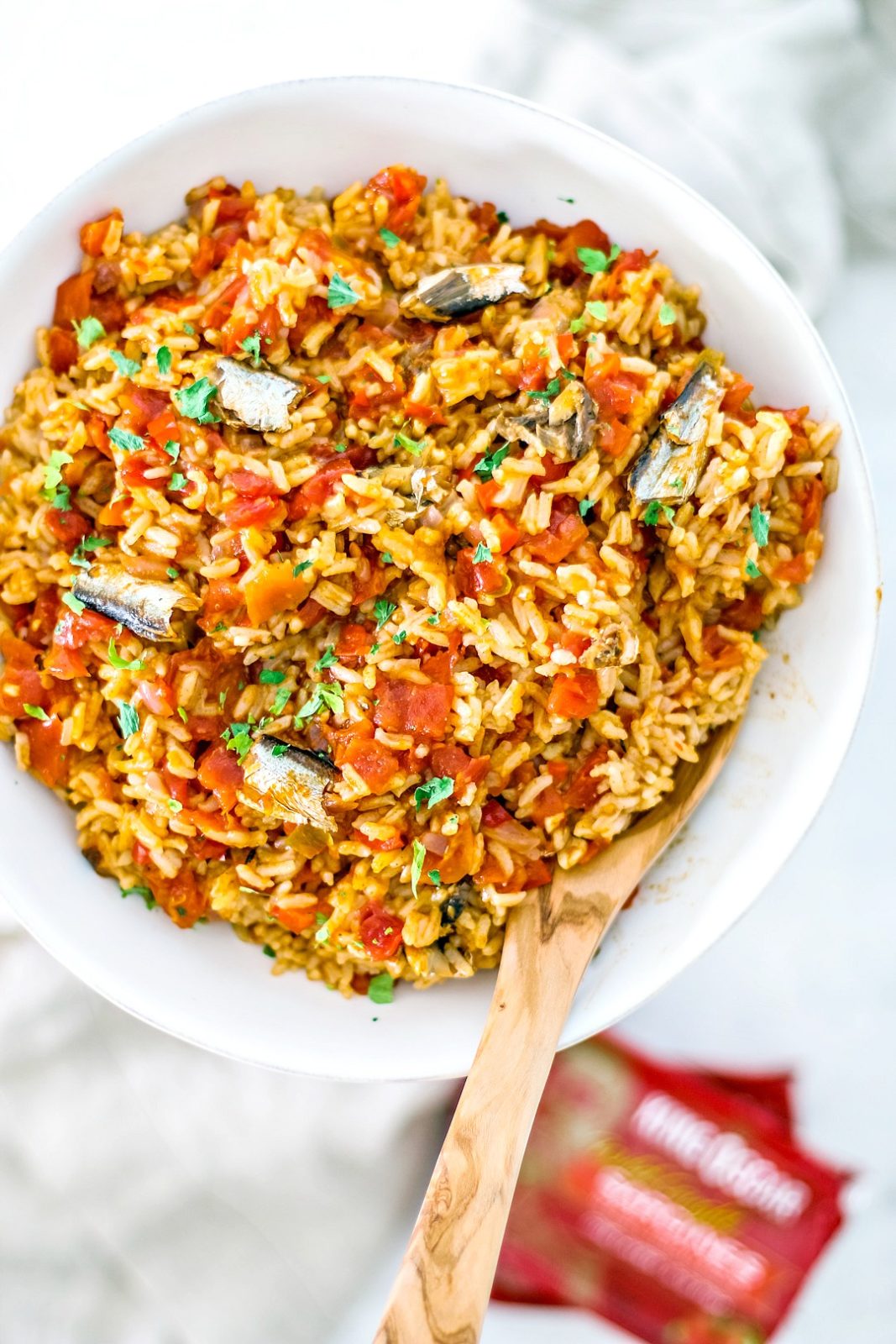 Spanish rice with sardines in serving bowl