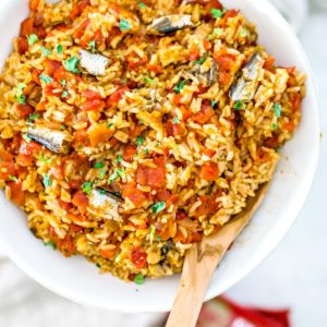 Spanish rice with sardines in serving bowl