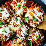 Saucy and cheesy eggplant parmesan in a skillet.