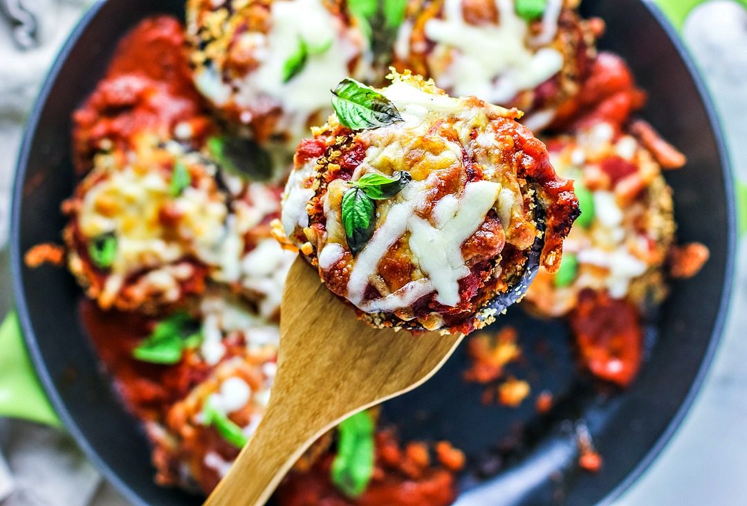 Saucy and cheesy eggplant parmesan in a skillet.
