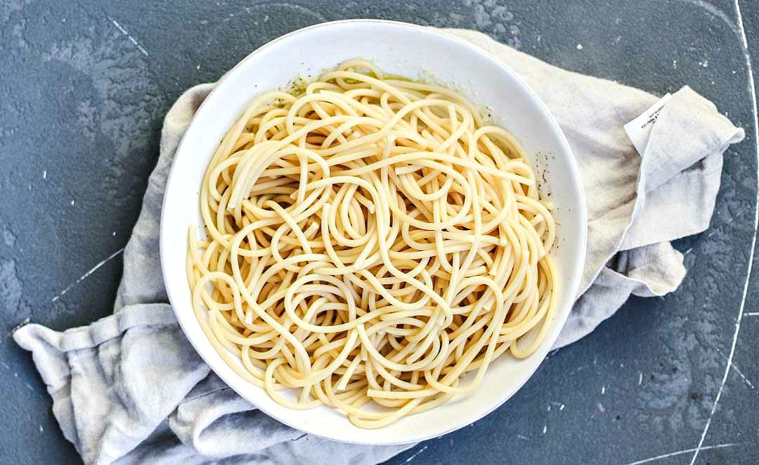 Bowl of bucatini pasta.