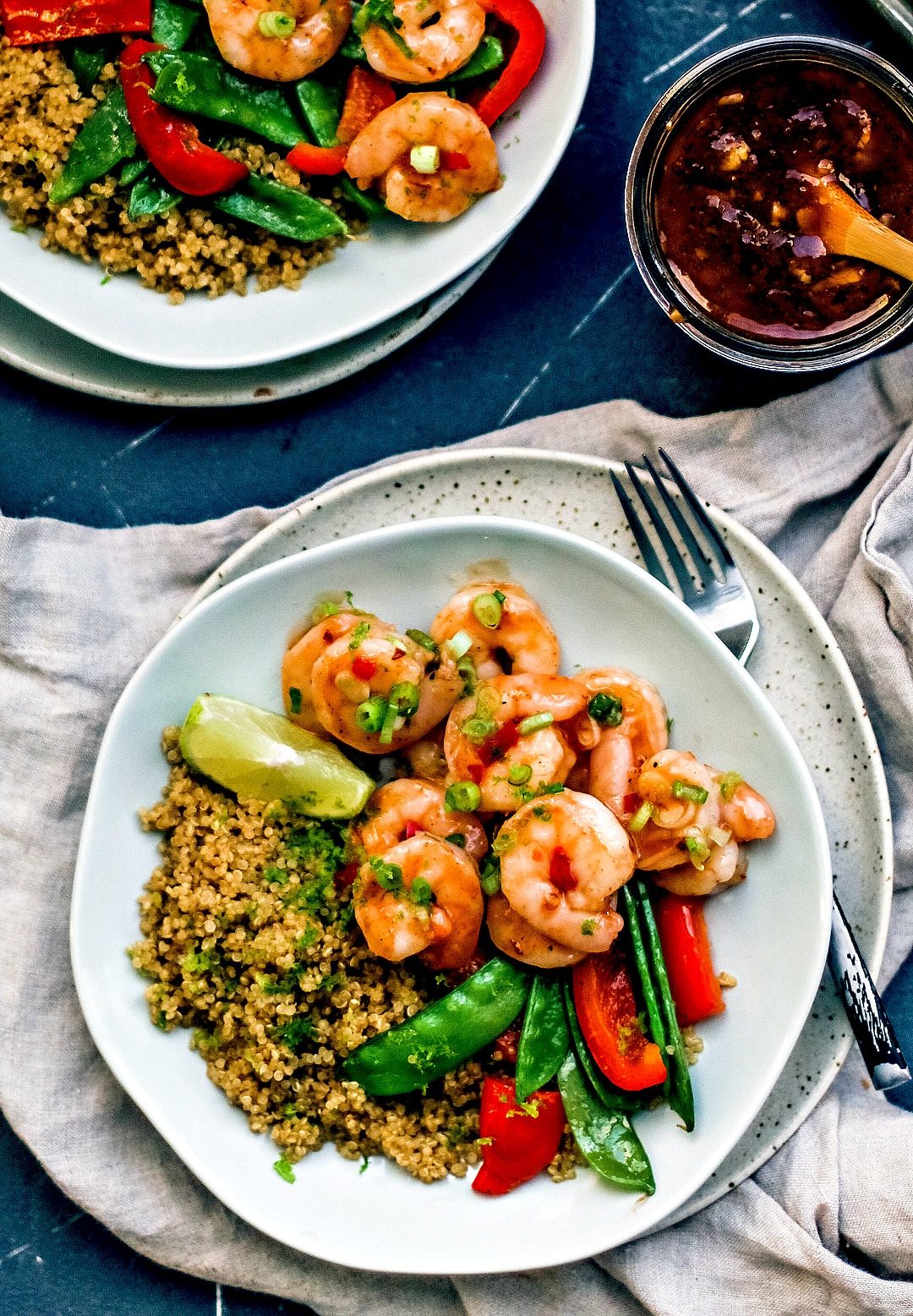 Plate of Spicy Thai Sweet Chili Shrimp with vegetables and quinoa.