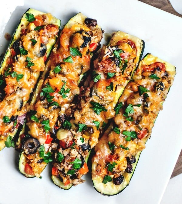 Tex Mex stuffed zucchini boats on a platter.