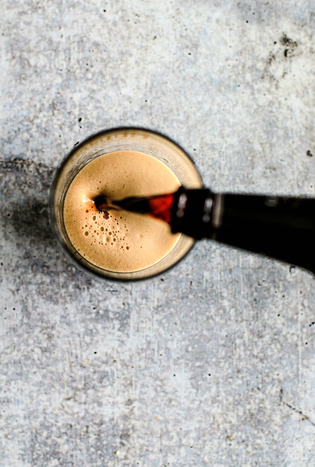 Guinness being poured into a pint glass.