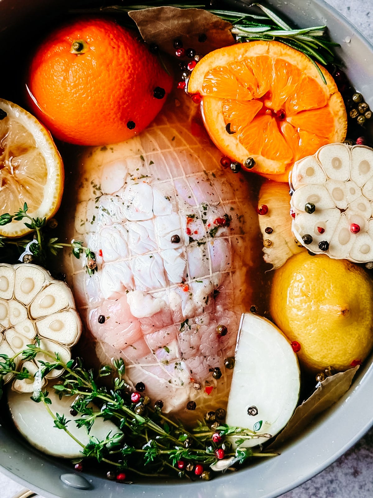 Turkey breast in brine with citrus fruit and herbs.