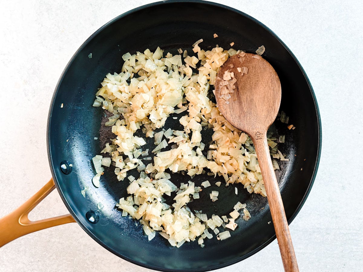 Onions saut&eacute;ed in a pan.