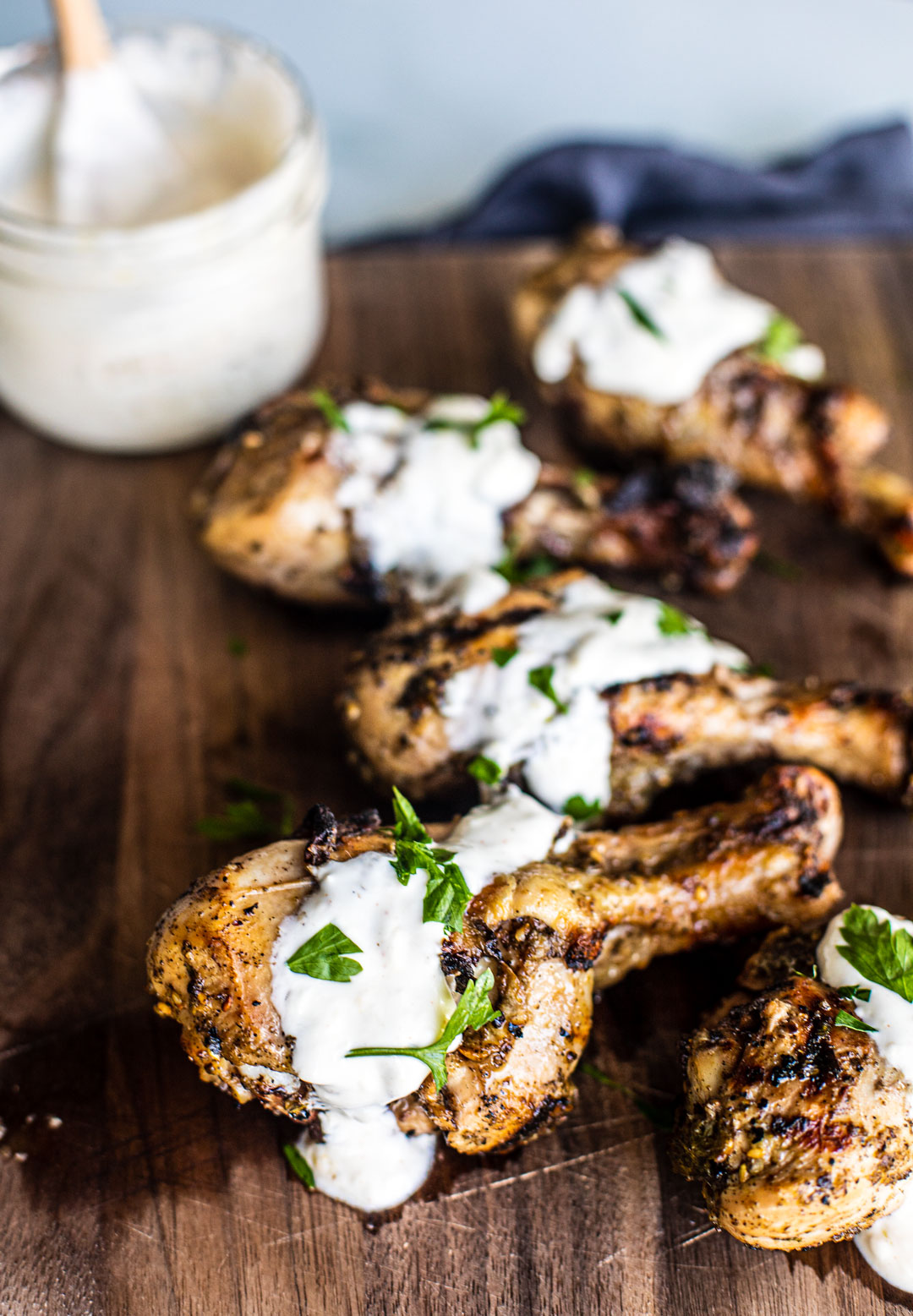 Vertical shot of grilled za'atar chicken drumsticks.