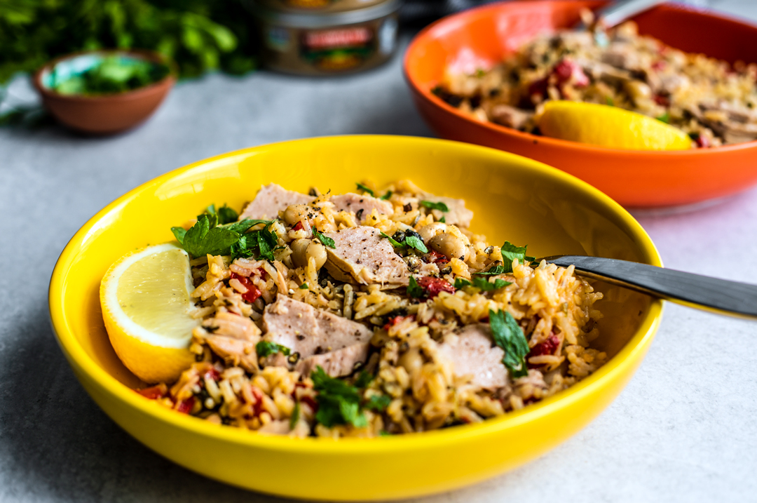 Side shot of bowl full of Mediterranean Instant Pot Rice with Tuna.