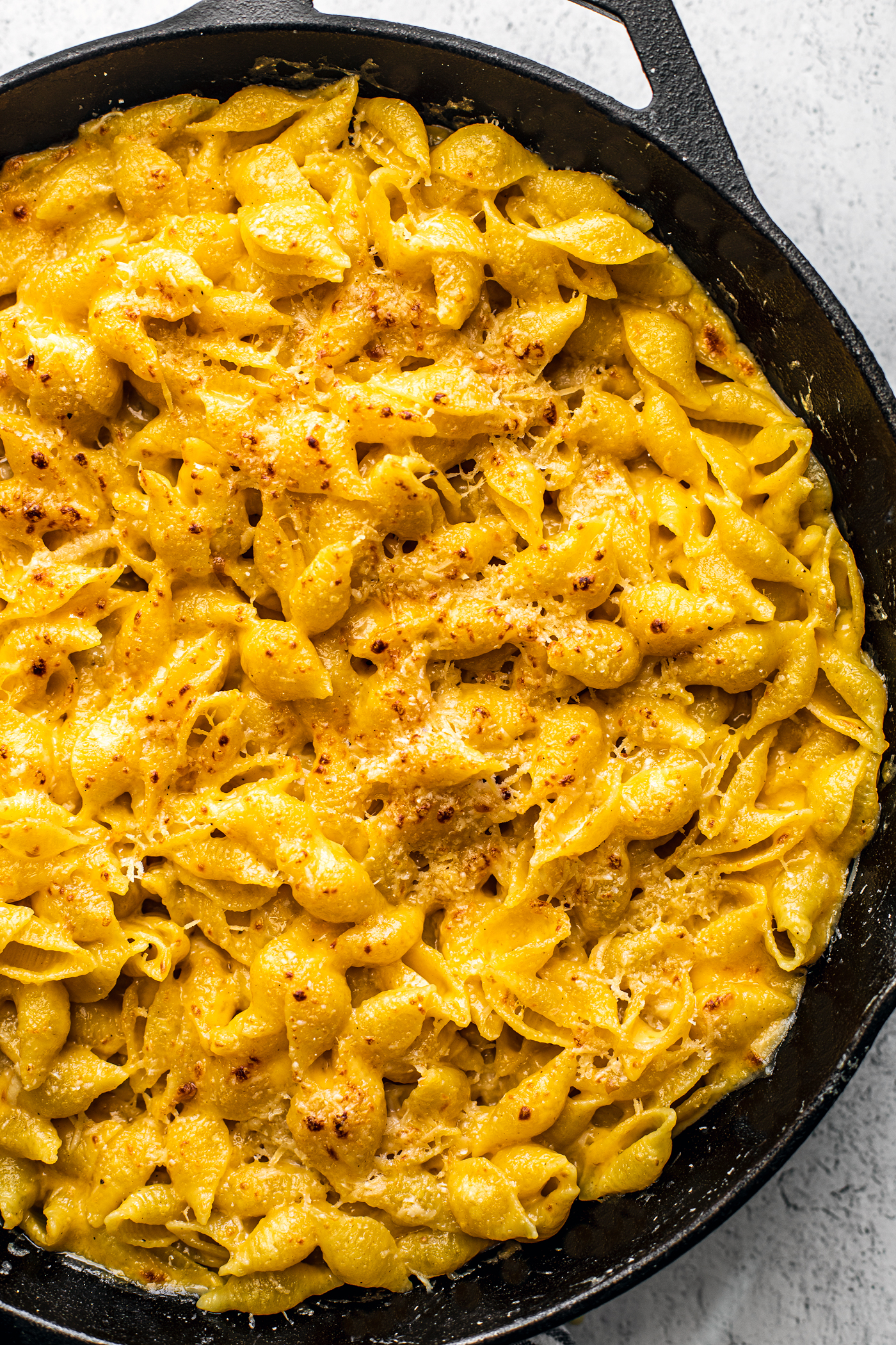 Baked mac and cheese in a skillet.