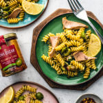 Three colorful plates of pasta next to a jar of KO tuna.