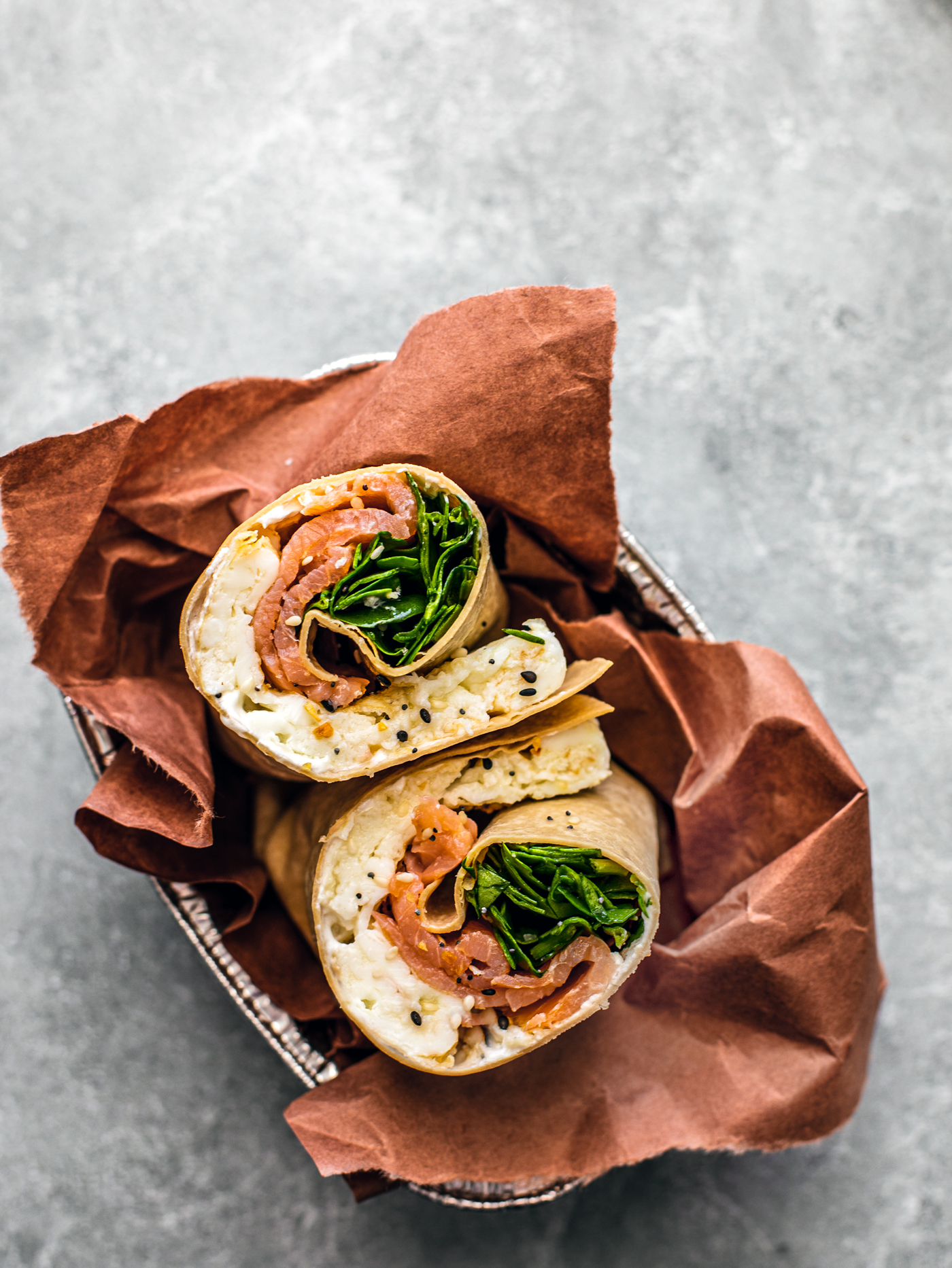 Smoked salmon wrap bundled in a serving tray.