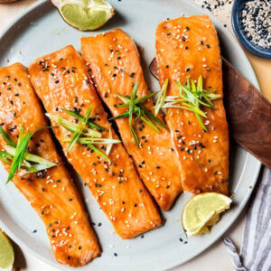 Baked Miso Salmon on serving platter with limes.