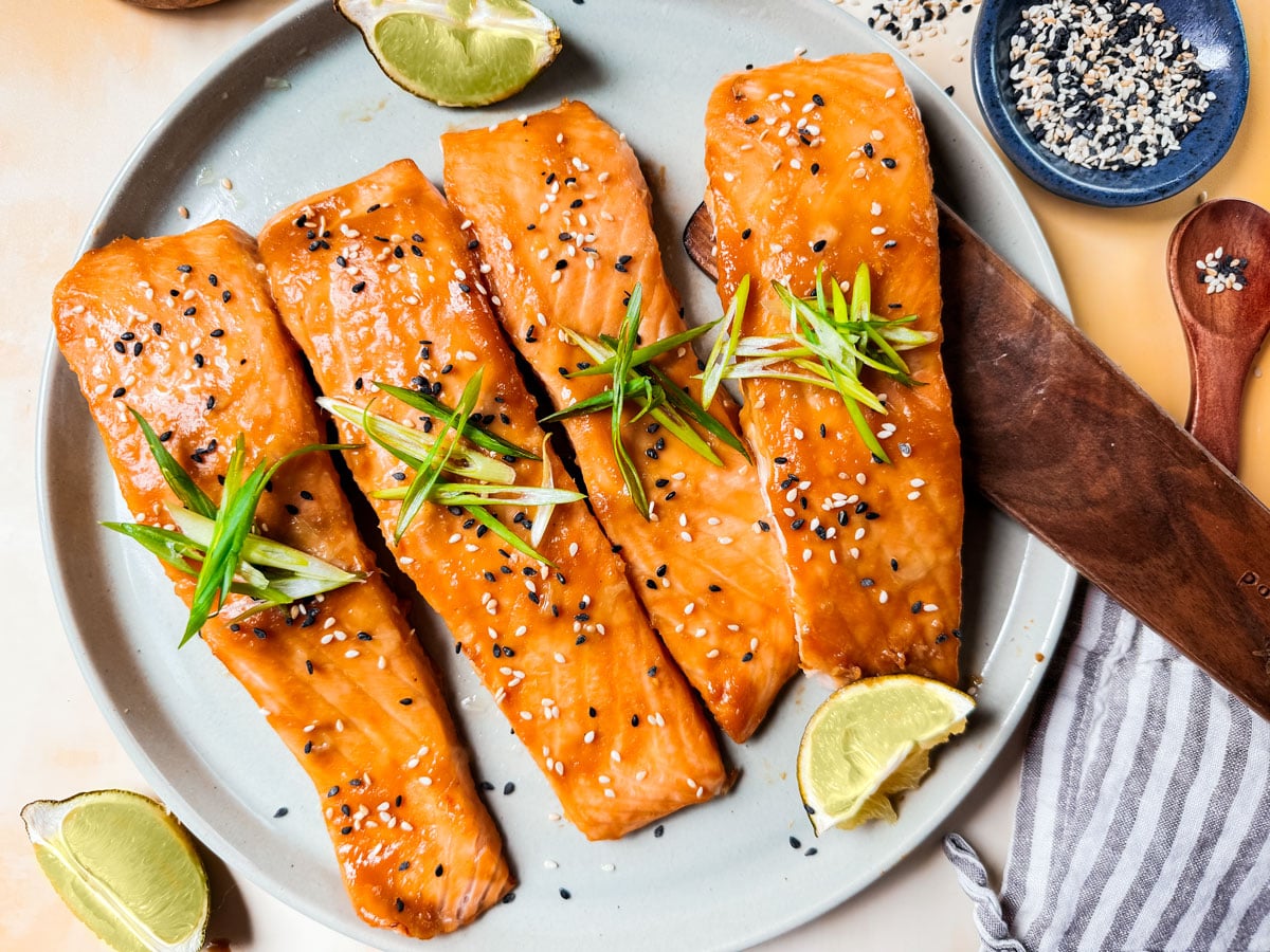 Baked Miso Salmon on serving platter with limes.