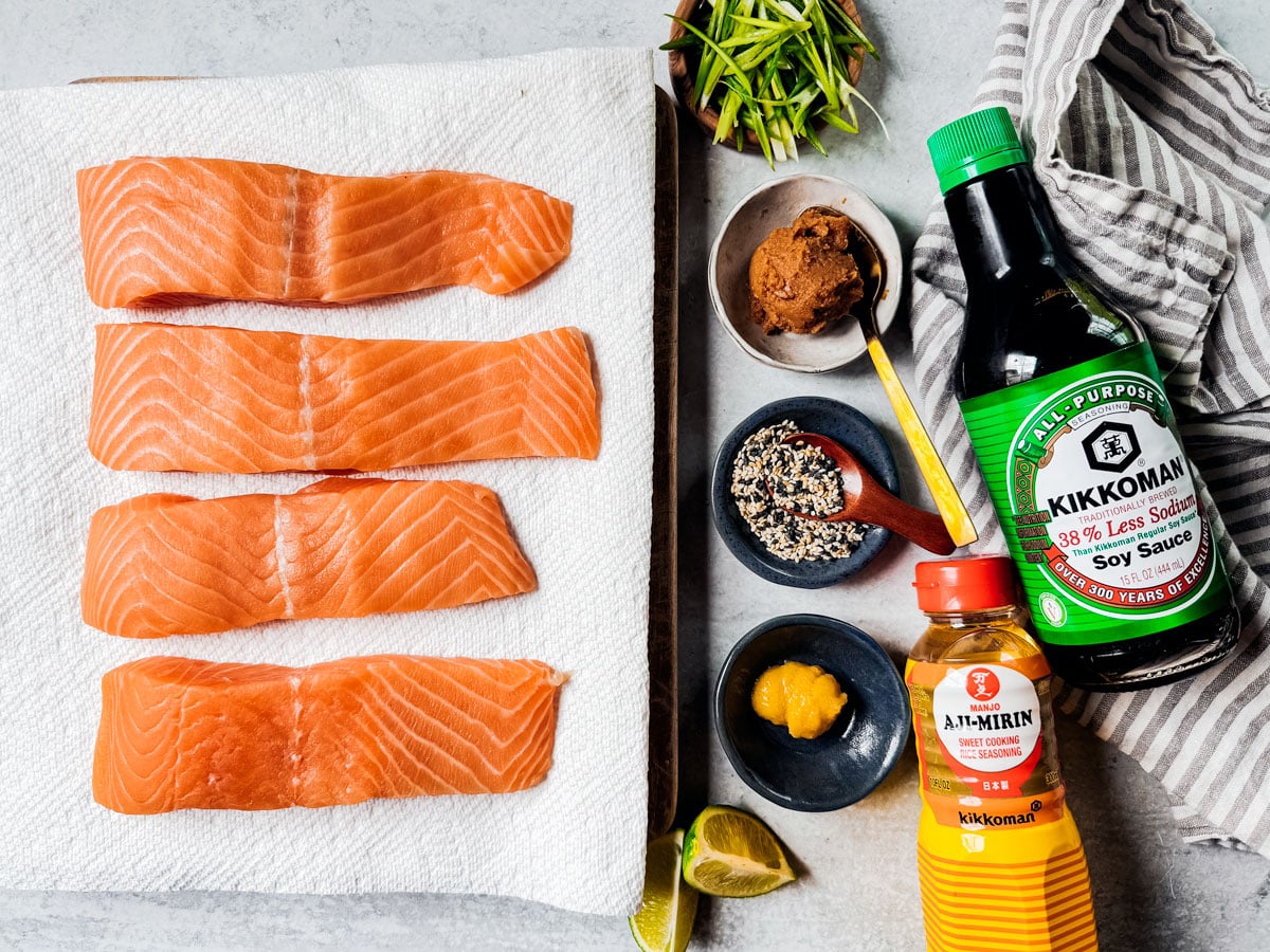 Ingredients for baked miso salmon on a white background.