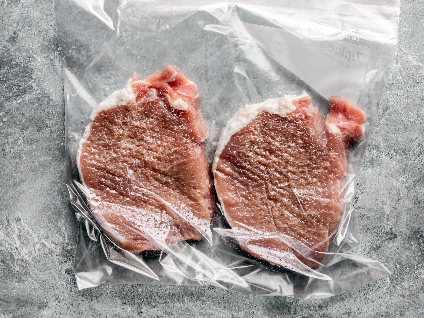 Tenderized pork chops in a bag.