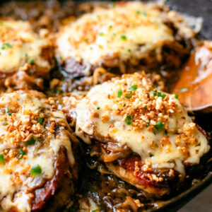 Pork chops smothered in onion gravy and cheese.