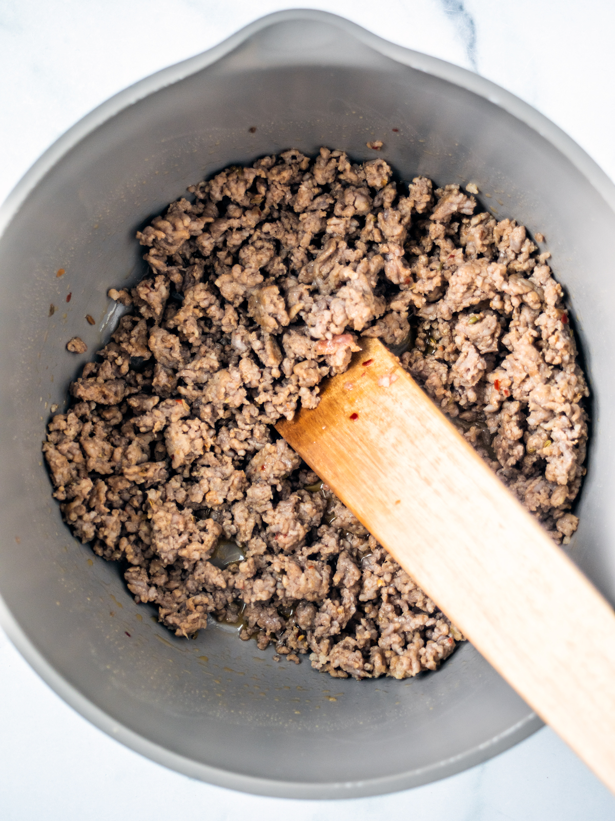 Pot of cooked ground sausage.