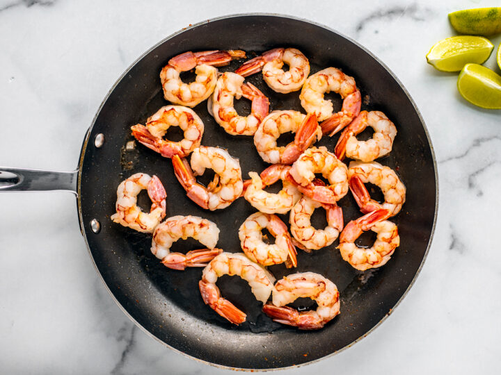 Pan with cooked shrimp.
