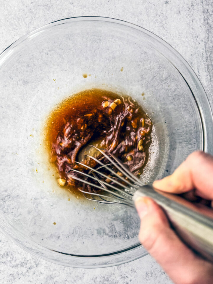 Marinade being whisked in a bowl.