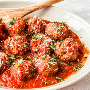Saucy meatballs in a serving dish.