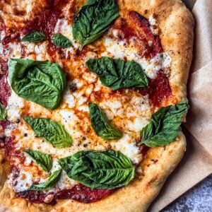 Air fryer pizza with fresh basil.