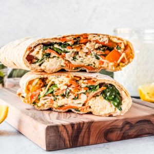Chicken Caesar Lavash Wrap on a wooden serving board.
