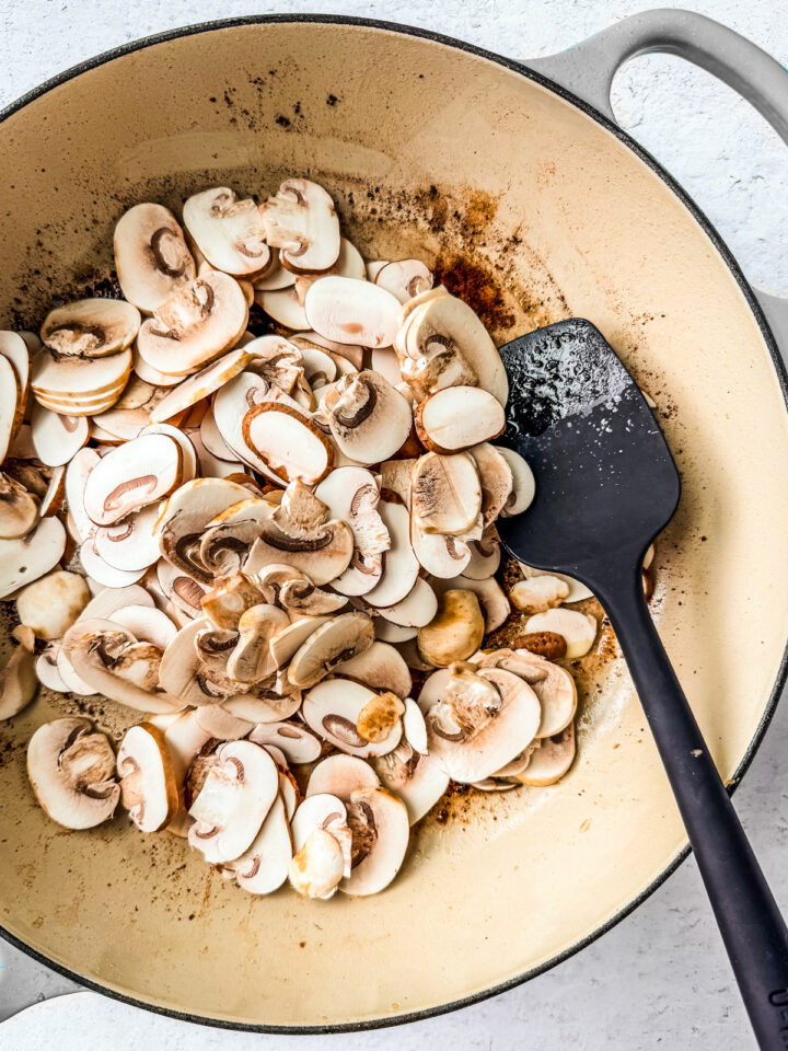 Uncooked mushrooms in a pan.