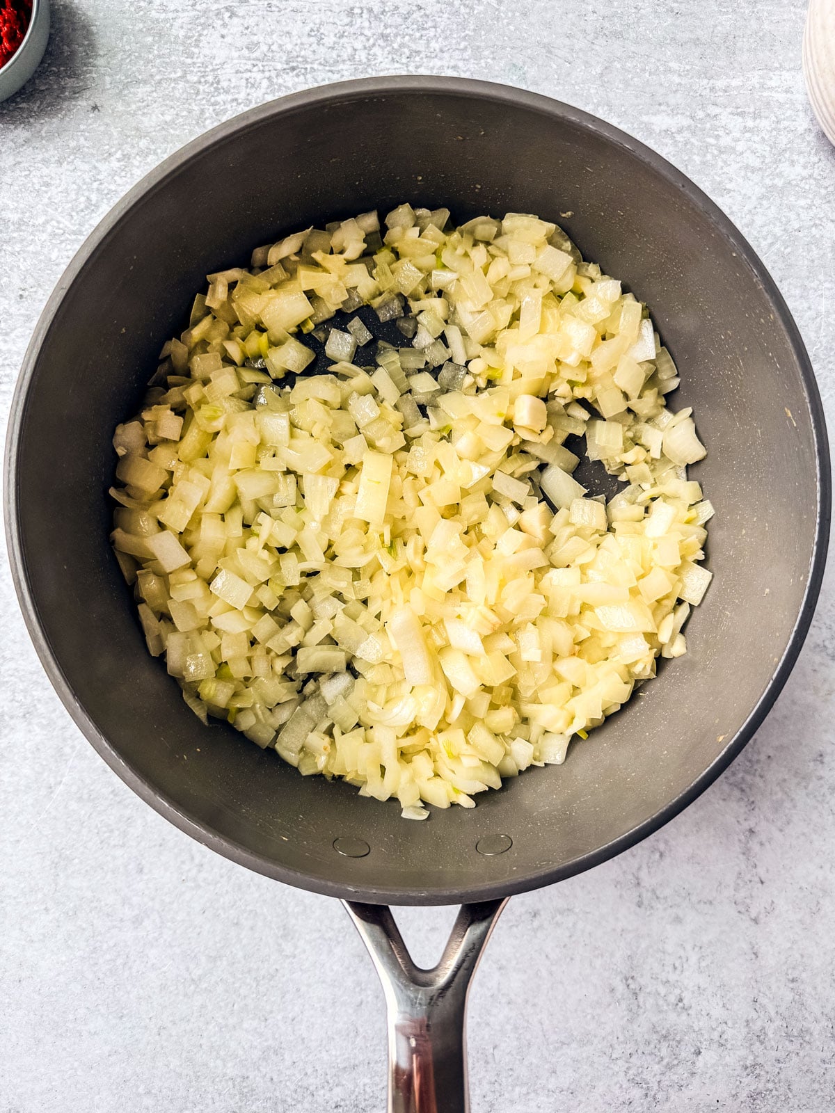 Pan full of cooked onions.