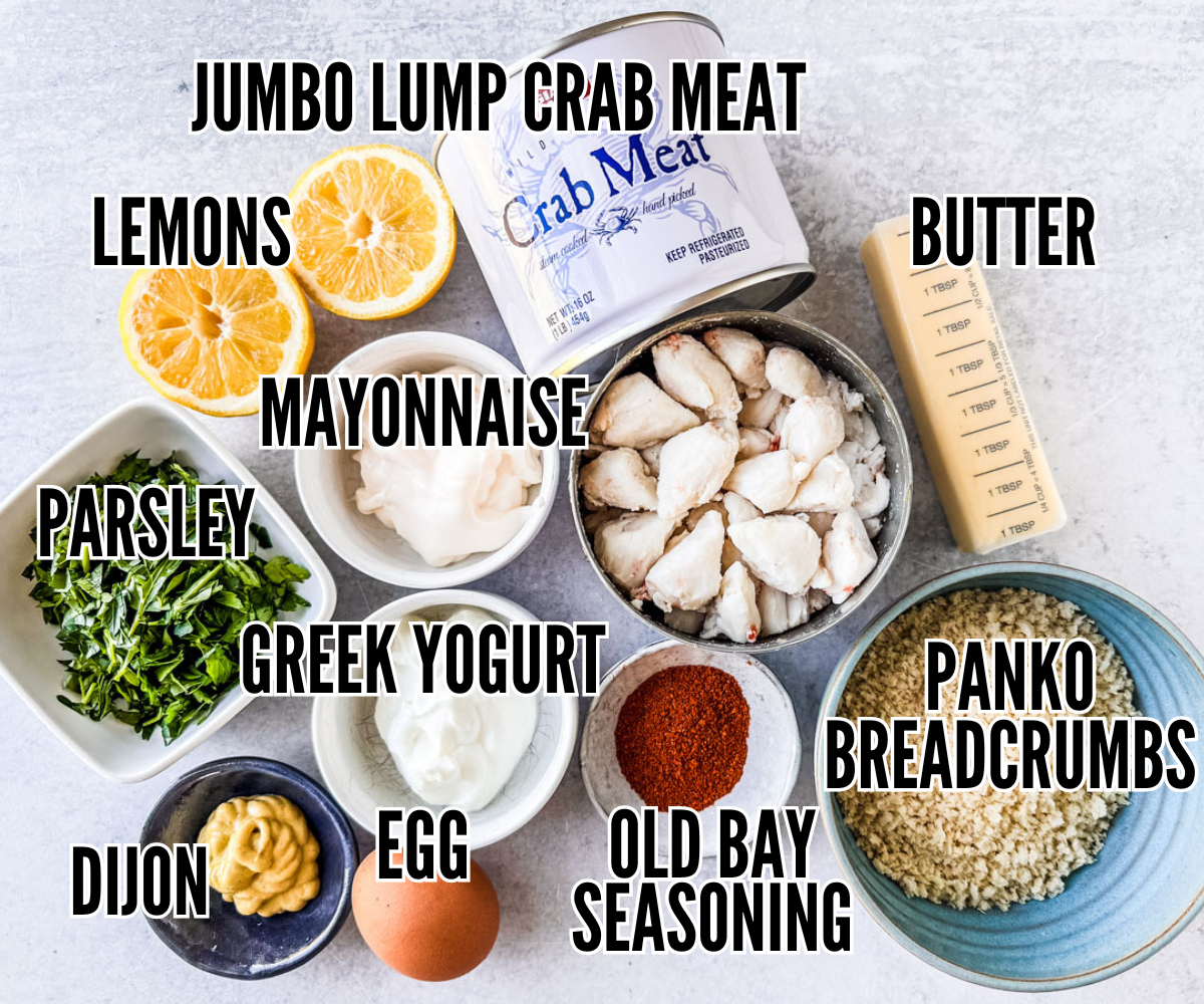 Ingredients for maryland crab cakes spread out on a light background.