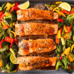 Teriyaki salmon with veggies on a sheet pan.