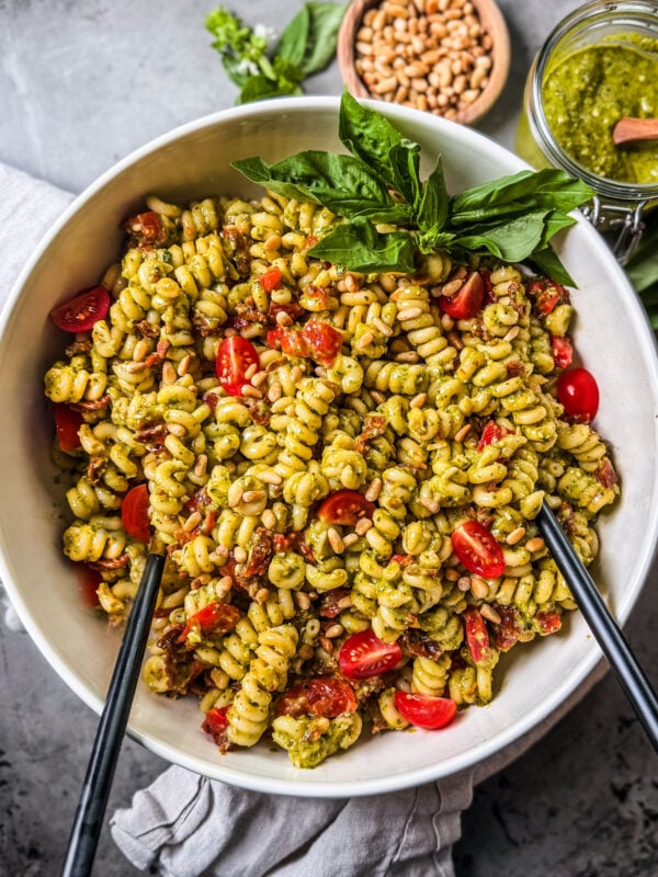 Pesto pasta salad in a serving bowl.