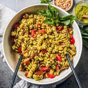 Serving bowl of pesto pasta.