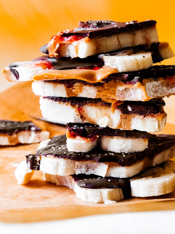 Stack of chocolate banana bark pieces.