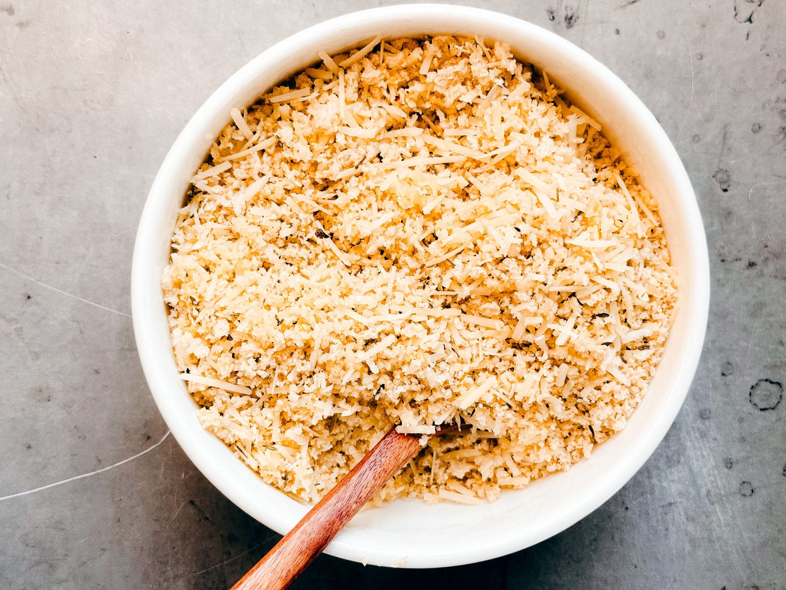 Small bowl of bread crumb and parmesan mixture.