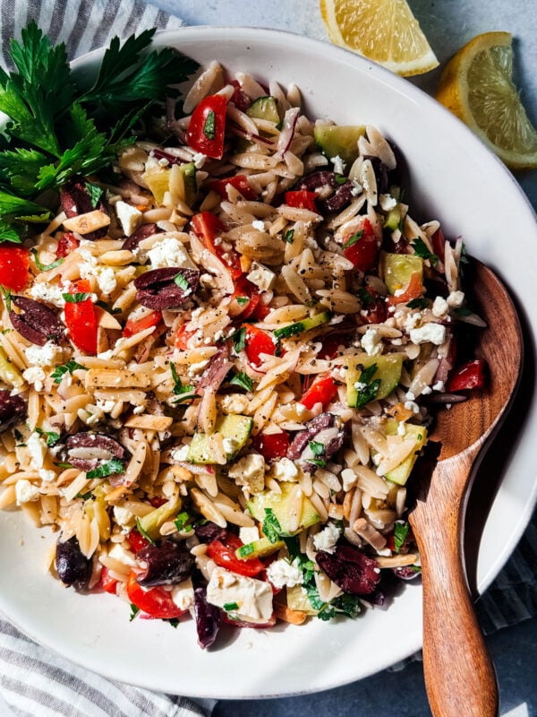 Mediterranean orzo pasta salad in a serving bowl.