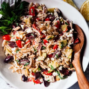 Mediterranean orzo pasta salad in a serving bowl.