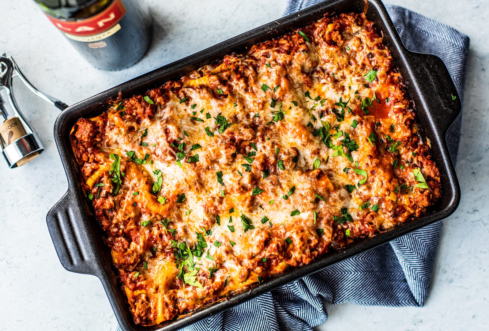 Overhead shot of baking dish full of cheesy lasagna.