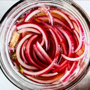 Quick-pickled red onions.
