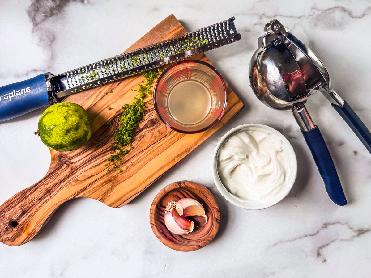 ingredients for lime crema on marble countertop.